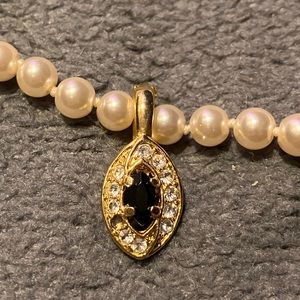 authentic pearl necklace with gold and onyx center